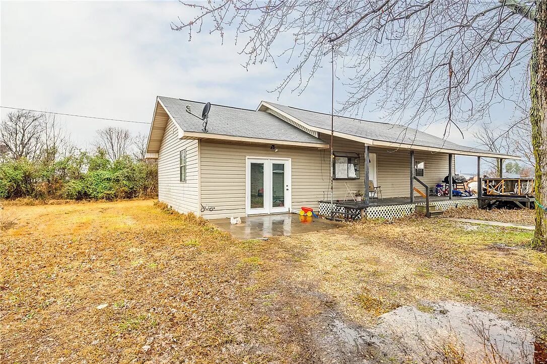 Get ready to giggle with delight at 23540 Highway 12, Gentry, Arkansas! This charming single-family residence, built in 1979, is practically begging for a fun-loving new owner to bring it to life. With a cozy 1248 square feet to play in, this home is the perfect size for making memories without getting lost in endless hallways. Inside, you'll find three bedrooms, just waiting for your personal touch. Imagine slumber parties, epic pillow fights, or simply a peaceful retreat after a long day of… well, whatever fun adventures you get up to! Each room is a blank canvas for your wildest decorating dreams. This delightful domicile is more than just a house; it’s an invitation to embrace a life of playful possibility.