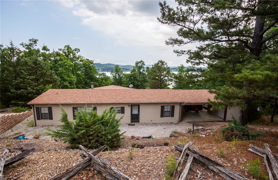 Packed with a punch is this 1,352sqft manufactured lakefront home, 3 bedrooms, 2 full baths and lots of updates. New HVAC, new roof, new plumbing lines, updated kitchen and baths, new flooring, insulation added as well as backyard fence, retaining walls and boathouse too! Great lakefront getaway on two lots about 1.24 acres and 223ft of shoreline, 1/2 circle topside drive, paved roads and city water too! Walk down the gradual slope to water, easy to launch kayaks or tie up boat for the day. Come see!