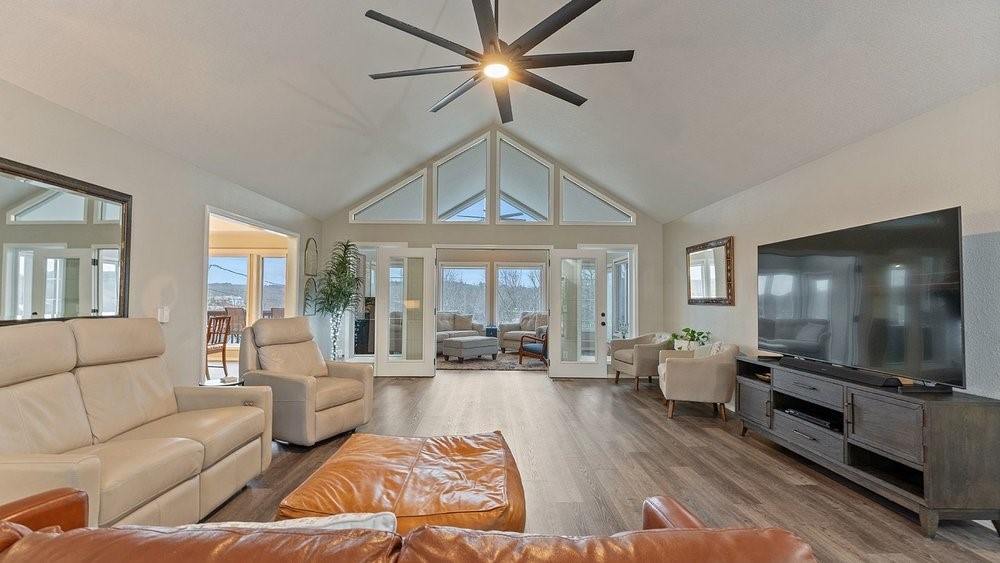 Beautifully renovated home with outstanding lake views in Bella Vista. This 3-bedroom split floor plan includes a dedicated office plus a heated/cooled basement flex room with private entrance—perfect for a guest suite, studio, or home gym. Basement is 233sqft not included in overall square footage! The standout sunroom features wall-to-wall windows with stunning views of Lake Loch Lomond and filling the home with natural light. Primary suite has a walk-in closet and huge jacuzzi tub. Kitchen features quartz counters, farm sink, & large walk-in pantry -spacious enough for everything! Fully renovated top to bottom in Fall 2023 complete with new appliances, new light fixtures and fans, fresh paint, LVP flooring throughout, & quartz countertops in the kitchen, laundry room, and both bathrooms. Major updates also include new roof/gutters (2023). Spacious 2.5-car garage and only the second owner. Cargill neighborhood is a great little community doing several events a year! Neighborhood events without subdivision feels!