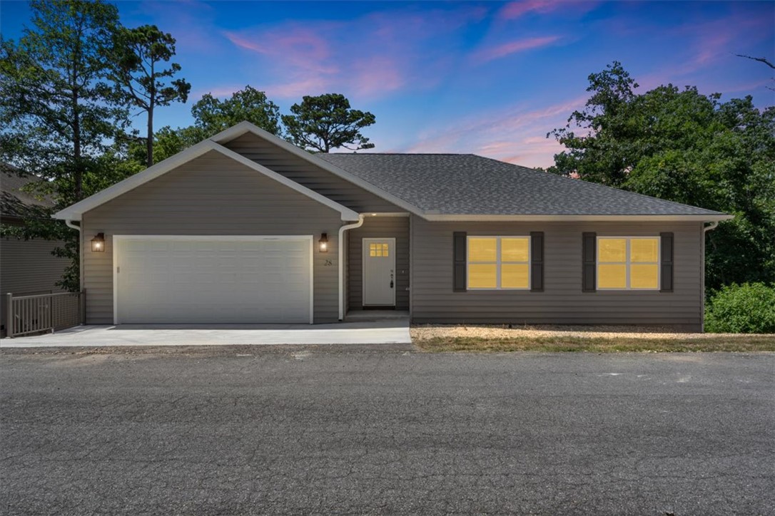 Beautiful Home- Tucked into the trees yet just minutes from everything, this newer construction home offers the best of Bella Vista living—peaceful, modern, and move-in ready. Step inside to find luxury vinyl flooring, quartz countertops, and an open, light-filled layout designed for comfort and style. The spacious deck invites you to relax or entertain while surrounded by nature. Love the outdoors? You’re just 5 minutes from the Back 40 trailhead and Highway 71, and less than 10 minutes to Bella Vista Country Club for golf, dining, and community fun. Whether you're settling in full-time or seeking a weekend retreat, 28 Fleetwood brings you home to the Ozarks—fresh, private, and perfectly located.