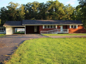 Beautiful rural setting near Overcup Lake. Home sits on 2 acres has large living area and large kitchen dining and family room combination.  There are outbuildings, a storm cellar, fenced garden area and lots of storage space.