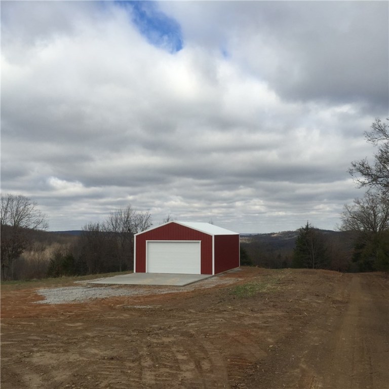 69.62 acres of beautiful property.  Lots of wildlife, wonderful views, and a great place to call your own.  There are building sites, enough pasture for livestock, or use it as a hunting retreat.  Cell phone service on almost the whole property, so you can keep up with the Razorback game from your deer stand!  20x30 metal building is less than 2 years old.  All but the last mile is paved roads.