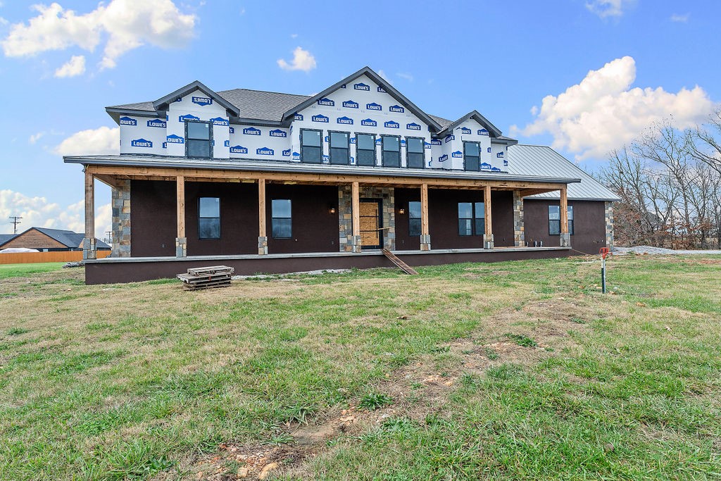 Experience privacy and space on 13.35 acres with this brand-new 4,857-SF home in Rogers. The great home welcomes you with soaring ceilings, a living-room fireplace, eat-kitchen and a formal dining room. The Master Bedroom suite includes its own private bath with a soaking tub, jetted shower with rain head, dual vanity and huge walk-in closet. The office has natural lighting and a full bath. Convenient laundry facilities and Living Rooms are on both levels. The 3-Car Garage is insulated. Upstairs has 3 Bedrooms with 2 full bath and Private Media Room for movie nights.  Home has spray foam insulation in all exterior walls and ceilings in addition to fully insulated interior walls making this home very energy efficient. Home also will include an outdoor kitchen.
With two levels of thoughtfully designed space and more than 13 acres of land, this new-construction home provides luxury, flexibility and privacy just minutes from Rogers.