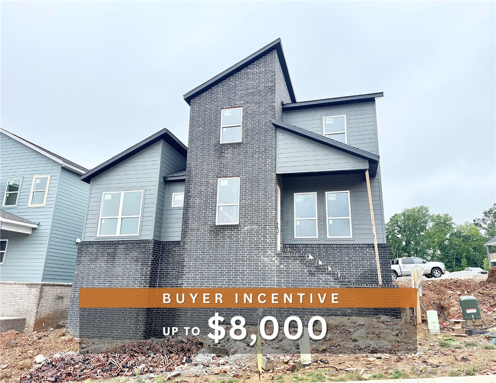 Discover this stunning modern home in the perfect East Fayetteville location—just a short walk to beloved Gulley Park! Ewan floorplan featuring designer finishes throughout! Enjoy a spacious open floorplan with a large living room, electric fireplace with accent wall, and beautiful wood flooring. The chef’s kitchen boasts 3cm quartz countertops, stainless steel frigidaire professional-grade appliances, custom cabinets to the ceiling with soft close door hinges, vented hood, and a walk-in pantry. The luxurious primary suite includes hardwood floors, custom beams, and a spa-like bathroom with walk in tile shower, soaking tub, double sinks and walk in closet. With a formal dining area with accent wall, loft upstairs for relaxing, cubbies to keep you organized, large covered patio, and included blinds and gutters, this home blends comfort, style, and convenience in one unbeatable package. POA maintained lawncare and access to Niokaska Creek Trail from the neighborhood!