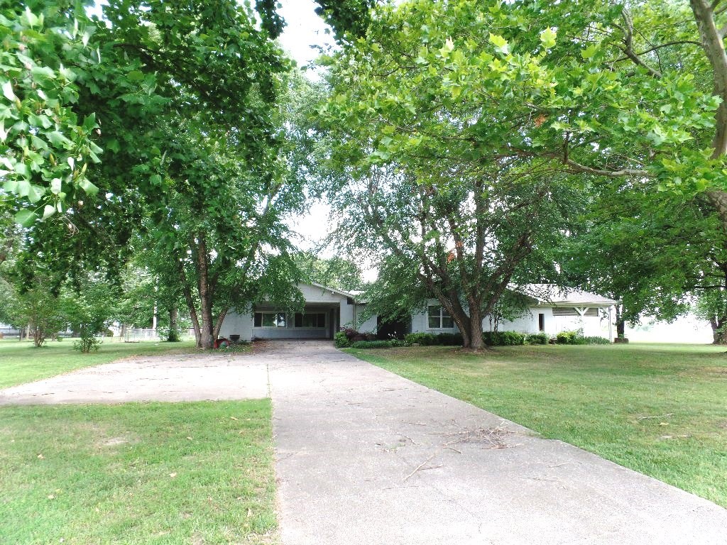 So Many Possibilities! Just needs a little TLC! Sits on a gorgeous lot in a nice location close town but a private feel. Large home on 2.29 acres and a huge workshop. Great back yard and beautiful trees all around. Bank Owned sold as is. Check this one out and make an offer - Great Property.