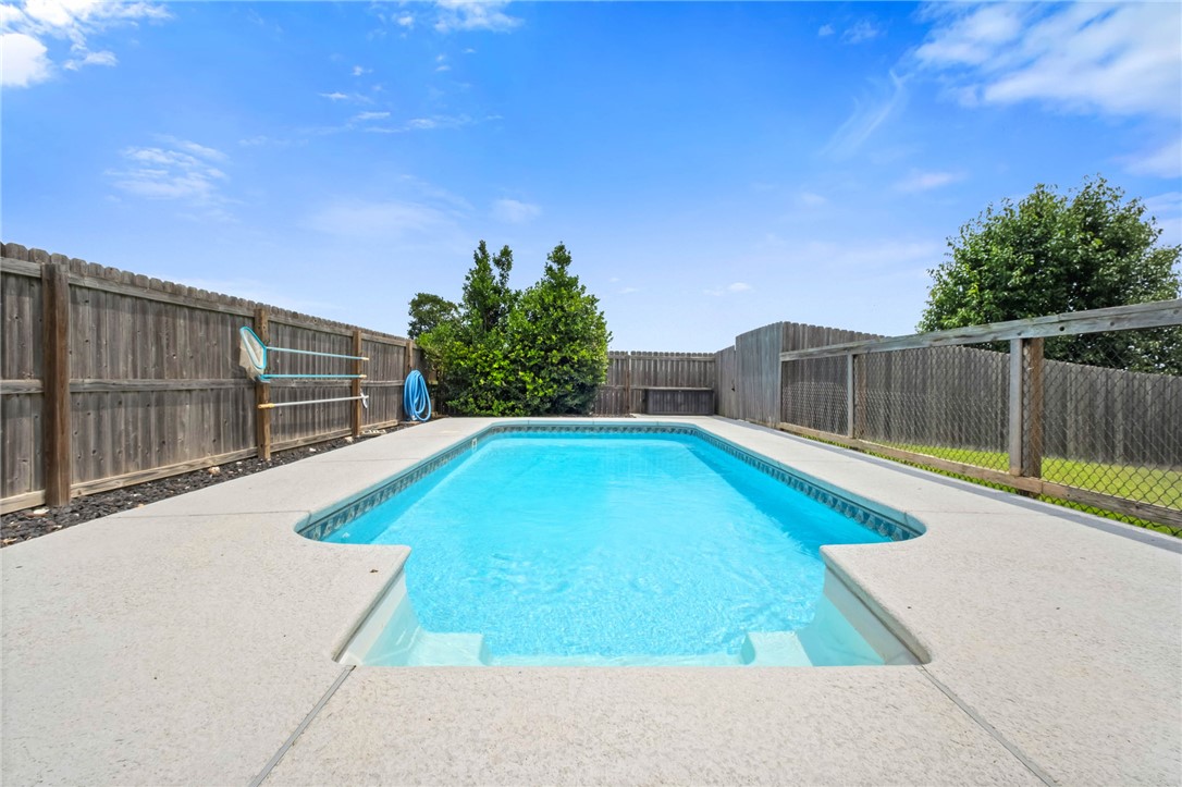 A home with a private in-ground pool in Cave Springs for under $450,000? Opportunities like this are hard to find. Welcome to 1507 Parkside Circle ideally located at the front of the subdivision and just steps from the neighborhood park and pool, this 3-bedroom, 2-bath home offers comfort, convenience, and great outdoor living. Inside, you'll find a cozy gas fireplace and a spacious primary suite with a jetted tub. Step outside to your private backyard oasis featuring an in-ground pool, perfect for entertaining or relaxing. A tornado shelter provides added peace of mind, while the prime location puts you close to top-rated schools, shopping, dining, and everything Northwest Arkansas has to offer.  *seller is offering a 1% incentive towards buyers closing costs with preferred lender*