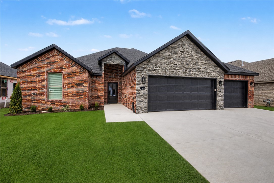 Welcome to this beautiful new construction home in Siloam Springs! This thoughtfully designed home offers a custom interior and exterior design of modern living space with quality finishes throughout. The exterior features classic brick construction, a 3 car garage, & an inviting curb appeal, while inside you'll find luxury vinyl plank flooring, an open & functional layout, & abundant natural light. The kitchen is equipped with quartz countertops, energy star appliances, eat-in kitchen space, & ample cabinetry. Enjoy outdoor living on the patio. Don't miss the opportunity to own this move-in-ready new construction home in a growing Siloam Springs neighborhood!