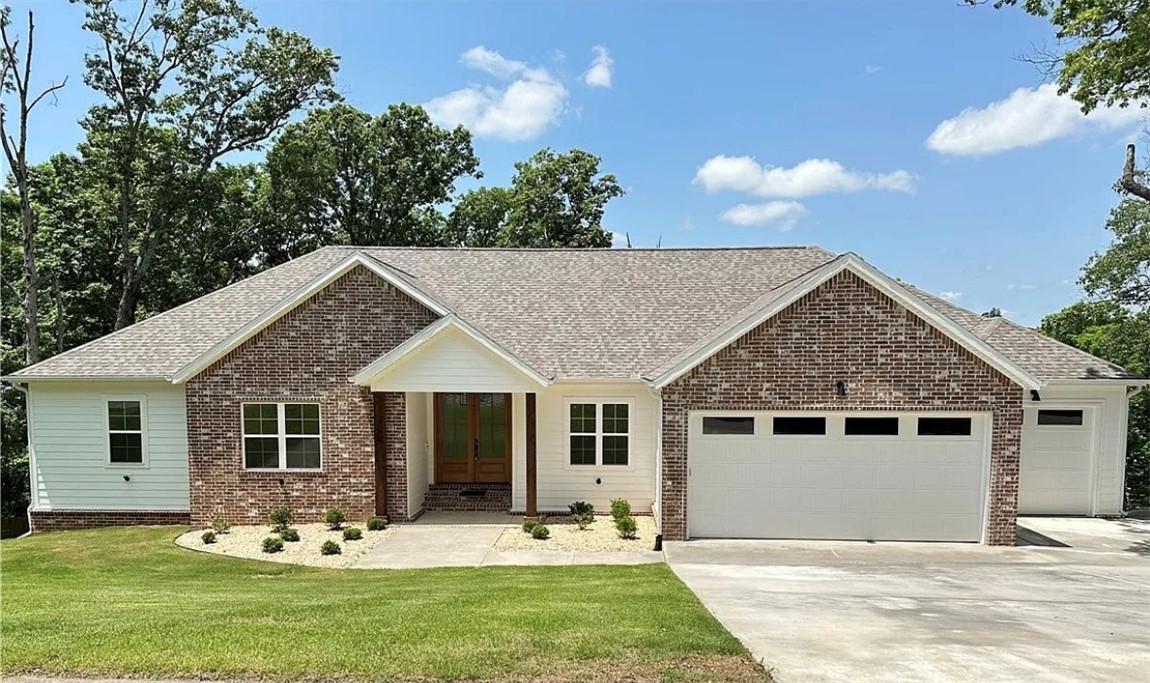 Welcome to Shelby Forrest, A quiet, wooded subdivision with large lots and beautiful settings. This new construction home situated on over an acre features an open floor plan, gorgeous countertops, custom cabinets, hardwood floors throughout, 4 bedrooms and 3 full baths and an oversized 3 car garage. The 4th bedroom serves as an ensuite with its own private bathroom. Enjoy the outdoors on the large covered deck. Centrally located just a few minutes from the center of Pea Ridge, 10 minutes to downtown Rogers and only 15 minutes from downtown Bentonville.