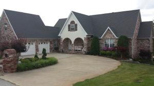 Wonderful custom built home on the 15th green of the golf course.  This beautiful home features 4 bedrooms, 3 1/2 baths, and over 3,000 sqft of living space for your family.  Relax on your large deck that overlooks the golf course, or hop in your cart and go play. The basement features golf cart garage and almost 1,000 sqft of storage and workshop area.