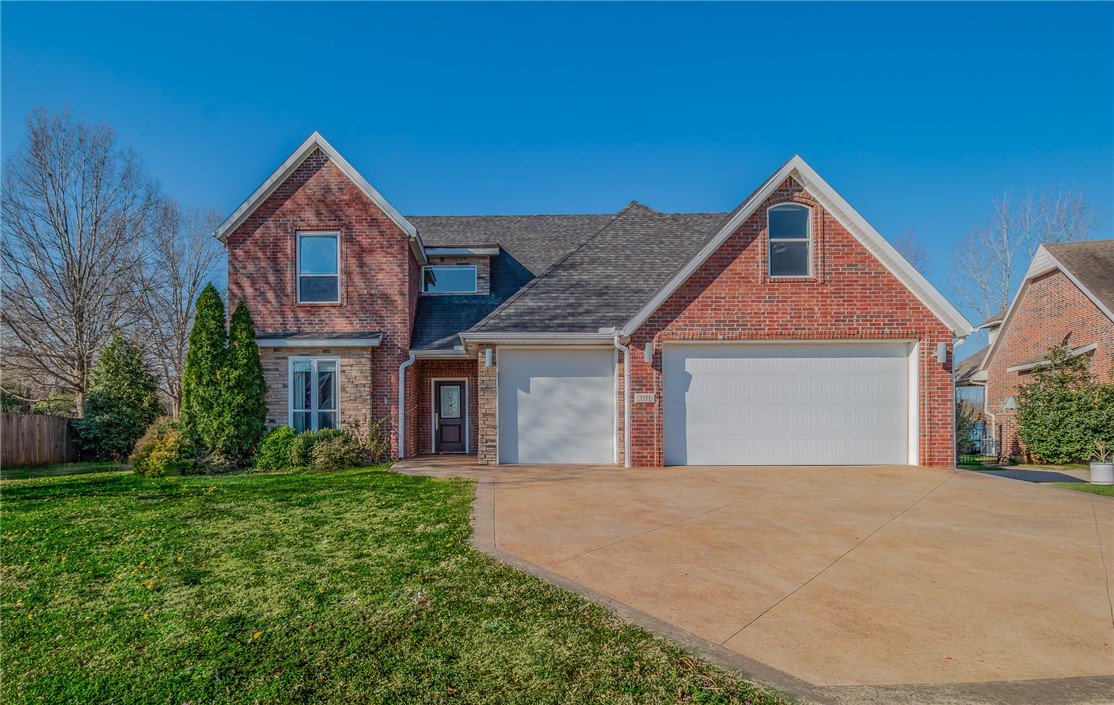 Discover modern living in this 5-star energy-efficient home, situated on a half-acre across from the Botanical Gardens of the Ozarks and Lake Fayetteville. Boasting 3,722 square feet, this four bedroom, three and a half bath home blends high-performance efficiency with unique design featuring polished concrete floors, a dramatic floating staircase, and brick accent wall. The main level offers an open-concept chef’s kitchen with a large prep-sink island, flowing seamlessly into an oversized living area, complete with a built-in desk or bar area. The primary suite is a spa-like retreat, showcasing floating vanities, a whirlpool tub, and an expansive walk-in shower. The upper level offers three bedrooms, two additional baths, large bonus room with wet bar, and a versatile lofted space. Combining high-performance efficiency with modern design, this property offers a rare opportunity to live steps from the Botanical Gardens of the Ozarks and Lake Fayetteville.