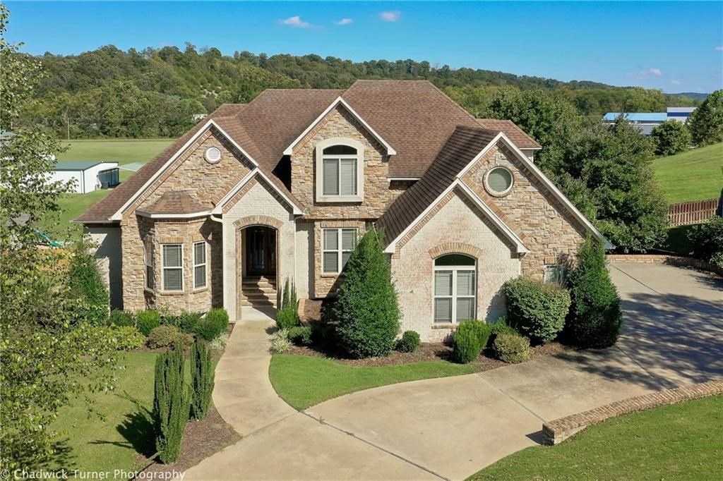 Enjoy incredible views from the multi-level deck of this fantastic home. This elegant home features a walk-out basement giving you extra space for everyone and everything. From the moment you walk in, you will love how this house feels. You are greeted with a large beamed living room that features huge windows. The decks face east so enjoy fantastic sunrises while in the evening you are kept cool in the share. New roof 10/2019, updated HVAC systems as well,Finished walk-out basement w/ extra storage . Special Financing Incentives available on this property from SIRVA Mortgage