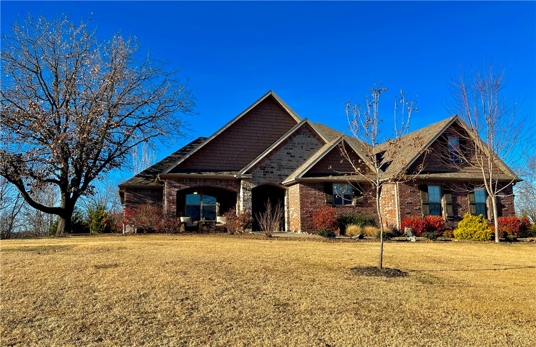Talk about rare and gorgeous! Custom built 4BR/3 Full BA home on over 2.7 private, wooded acres in gated Estates of Lakeway. This lake home comes w/ it's very own boat slip with lift in neighborhood dock. It boasts of exclusive ownership, plus enormous swimming platform all located on a cove on Beaver Lake. Home has been immaculately kept w/ pride of ownership throughout. Expansive, open floor plan complete w/ chef's kitchen, large center island, GE appliances, granite countertops, and even a cabinet with stand mixer lift! Wood floors and a cozy wood burning fireplace highlight the huge living room which opens to a covered area with outdoor fireplace, rock patio, and private backyard with peach, cherry, apple, & pecan trees. Upstairs was built for ultimate flexibility. It easily serves as a second master with a full bath, but is also built as your family media, exercise, bonus or hobby room. The Master BR has private patio access, a massive master BA and closet that adjoins the utility room. So Smart!
