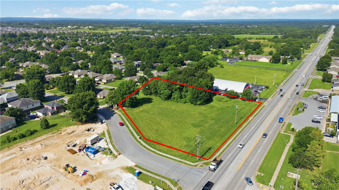 Prime 1.80-acre commercial corner lot on one of Fayetteville's busiest corridors! Located on highly visible Wedington Drive with traffic counts exceeding 25,000 vehicles per day and just minutes from I-49 with over 75,000 vehicles daily, this property offers outstanding exposure for your business or investment. Currently zoned Residential Office, with a future land use designation of City Neighborhood (subject to city approval), offering excellent long-term development potential. Situated within the sought-after Wedington Corridor, the property is surrounded by established neighborhoods, restaurants, grocery stores, fitness centers, retail, and the University of Arkansas, providing a strong customer base and steady traffic. Excellent visibility, easy access, and a central location make this an ideal site for professional offices, medical, retail, service businesses, or future redevelopment. Invest in one of Northwest Arkansas' fastest-growing commercial corridors!