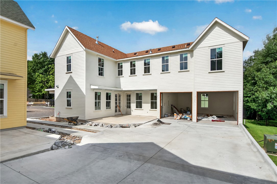 Welcome to Smyth Crossing – where history, community, and thoughtful design meet in East Fayetteville’s coveted Crossover area. Born from a vision to preserve the cherished home of immigrant Peter Smyth, this neighborhood blends heritage with modern living. Tree-lined streets, green spaces, and timeless architecture create a place to connect and celebrate the Ozarks’ beauty. Among its standout homes, The Bent House combines charm, function, and versatility. You will find 4 bedrooms, 3.5 baths and a large bonus room. A welcoming front porch and private courtyard offer inviting spots for morning coffee or evening tea, while the open floor plan inside flows effortlessly for entertaining and everyday living. Luxury finishes and an efficient layout make this home as stylish as it is comfortable. Minutes from top schools, parks, trails, and shopping. More than a neighborhood, it’s a living tribute where legacies are honored and new stories begin.