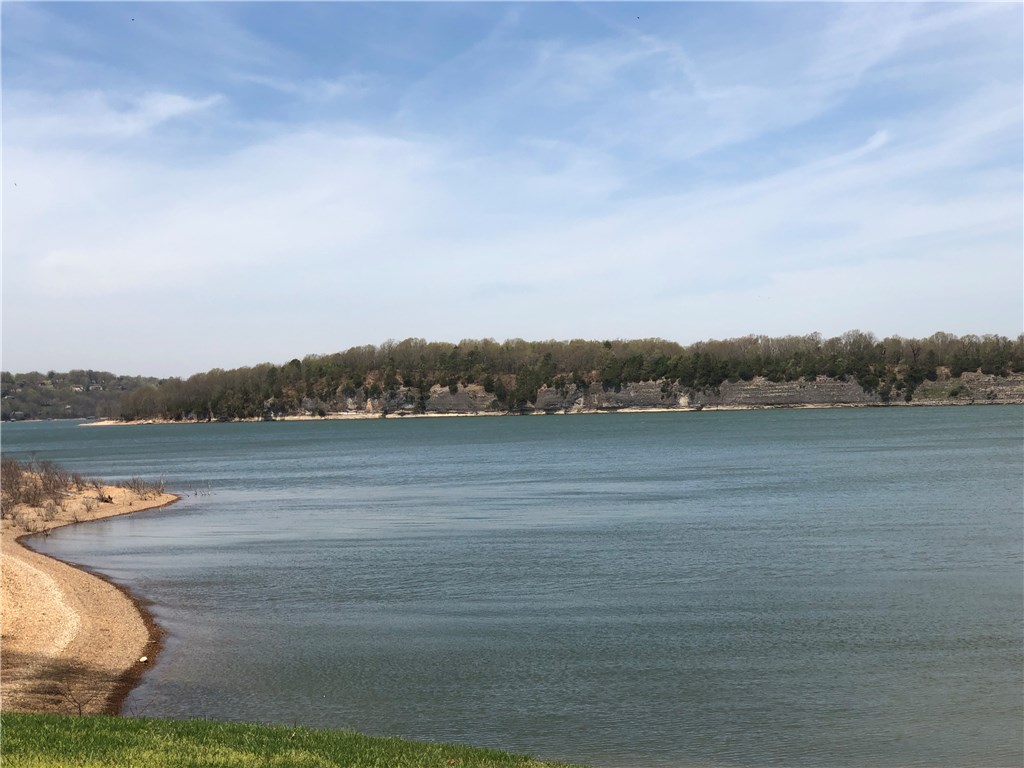Recently updated Heritage Bay condo with boat slip. Gorgeous views of beaver lake, Heritage Bay amenities include indoor swimming pool, tennis courts. Come and enjoy the lake without the hassle of exterior maintenance. Water and sewer are provided by Heritage Bay POA. Refrigerator, washer and dryer convey.