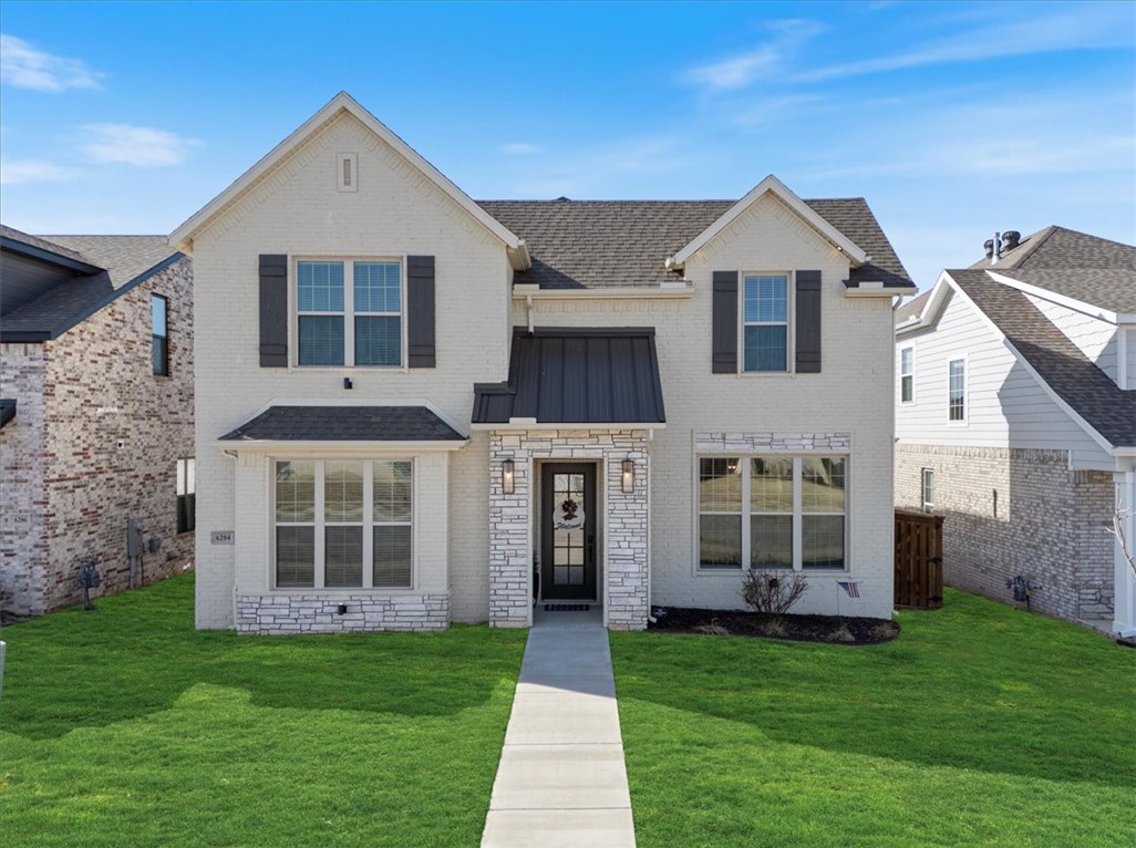 Nestled in Bentonville’s highly sought-after Aurora community, this thoughtfully designed EAST facing home offers access to one of the area’s most desirable neighborhoods featuring resort-style amenities including an adult-only pool, family pool, clubhouse, playground, pickleball court, and dog park. The open-concept living, dining, and kitchen areas create an easy flow for everyday living, with a large island, pantry, and engineered hardwood floors throughout the main level. French doors lead to a covered patio with an outdoor gas fireplace overlooking a backyard upgraded with $20,000 in professional artificial turf. The primary suite is located on the main floor with dual closets, a soaking tub, walk-in shower, and double vanity, while two additional bedrooms and a shared bath are upstairs. Like-new, well-maintained. Preferred lender offering up to $3,000 in credits for qualified buyers.