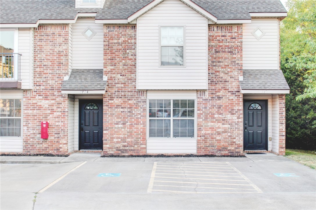 Located right next to the Northwest Arkansas trail system and less than a block from Nomads Trailside Kitchen and Bar this newly updated condo with 3 bedrooms and 2 full bathrooms enjoys a spacious living room with high raised ceilings that has a sliding glass door stepping out onto the patio. The open living plan includes a separate dining space and kitchen with access to the laundry room and additional storage. The kitchen opens to the living room and enjoys the light of a window just over the sink, a separate pantry, also has new granite countertops and includes all of the appliances (refrigerator, microwave, range, dishwasher). The main level enjoys a spacious bedroom with large bay of windows and a private bathroom with granite countertops. Upstairs are two additional bedrooms and a full bathroom. The home received (last year) new flooring throughout, new granite countertops, new paint, ceiling fans in all of the bedrooms and feels like a newer place. *Agent Owned*