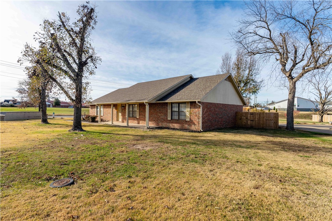 Welcome to this well-maintained home in the desirable Chateau Terrace neighborhood. This 3-bedroom, 2-bath home offers a functional layout with a cozy fireplace anchoring the living room and walk-in closets in all bedrooms. The 2-car garage provides excellent storage, complemented by an additional storage building in the backyard. Enjoy outdoor living with both a covered front porch and a covered back patio overlooking the level, fully fenced backyard—ideal for relaxing, entertaining, or pets. Conveniently located near the business district, shopping, restaurants, and everyday amenities, this home offers comfort, space, and an excellent location. A great opportunity to enjoy easy living in an established neighborhood.