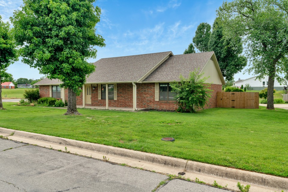 Welcome to this well-maintained home in the desirable Chateau Terrace neighborhood. This 3-bedroom, 2-bath home offers a functional layout with a cozy fireplace anchoring the living room and walk-in closets in all bedrooms. The 2-car garage provides excellent storage, complemented by an additional storage building in the backyard. Enjoy outdoor living with both a covered front porch and a covered back patio overlooking the level, fully fenced backyard—ideal for relaxing, entertaining, or pets. Conveniently located near the business district, shopping, restaurants, and everyday amenities, this home offers comfort, space, and an excellent location. A great opportunity to enjoy easy living in an established neighborhood.