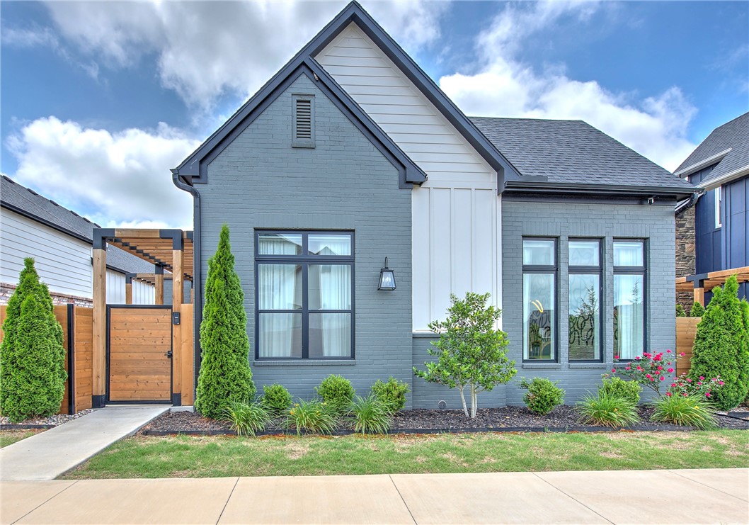 Welcome to Harmony, the premier Garden Home community in the heart of Northwest Arkansas, where luxury, culture, and convenience come together. This stunning floor plan delivers lavish lock and leave living without the maintenance of a large estate, perfect for travelers, outdoor enthusiasts, or those seeking quiet luxury while downsizing. Inside, soaring 12 foot ceilings and endless windows fill the home with natural light and an open air feel. Oversized waterfall quartz islands anchor the chef’s kitchen, complete with soft close cabinetry to the ceiling, GE Cafe appliances, and walk-in pantries. Sliding panoramic doors create seamless indoor-outdoor entertaining spaces leading to private patios and al fresco dining. Enjoy formal dining for 16+, plus a luxurious primary suite with a spa-inspired bath, polished tile, designer fixtures, and a soaking tub. Surrounded by art, dining, golf, cycling, music, and innovation, this community offers an elevated lifestyle in one of the region’s most desirable locations.