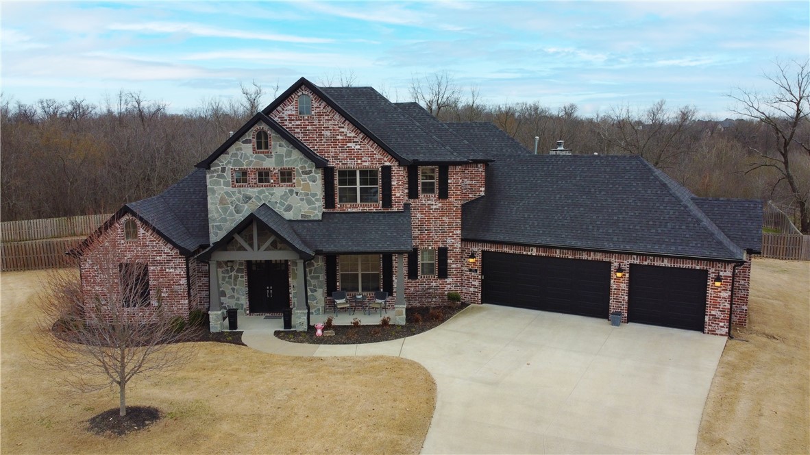 Just what you have been looking for!  This custom built Otter Creek estate home sits on almost an acre at the end of a quiet cul-de-sac. Modern and inviting describes the interior with a remarkable open floor plan, vaulted ceilings with wood beams, 3 impressive fireplaces, and large windows throughout the main floor & wired for sound.  The main floor office has a custom built in desk and french doors.  A chef's dream, the kitchen has a Thermador Professional gas cooktop with pot filler and Kitchen Aid brand stainless steel appliances. Adjacent to the kitchen is an oversized bonus room with bar area/kitchenette and wood-burning fireplace.  The upper level has 2 bedrooms with private ensuites along with a study nook with built in desks.  The large, private, fully fenced backyard backs up to the nature preserve meaning no one will ever build behind you!  The backyard has a saltwater pool, large patio, built in grill and large brick fireplace...the perfect place for entertaining!  See attachment for additional details.
