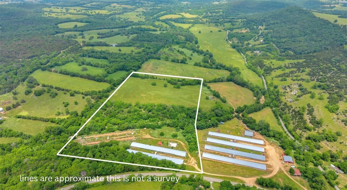Do not miss this opportunity to own approximately 30.35+/- acres in Berryville, AR featuring two previously used 40x400 poultry houses, open pastureland, and excellent agricultural potential. The poultry houses are no longer operational or usable for poultry production but would make great storage for farm equipment, hay, or other agricultural use. The property offers a beautiful field ideal for cattle or grazing, along with a water well already located on the property. Additional features include electric and water hookups already in place. Whether you are looking for a cattle farm, hobby farm, investment property, or usable acreage with existing infrastructure already established, this property offers endless possibilities in a great location. Legal: Exact legal description and exact acreage amount to be determined by new survey prior to closing