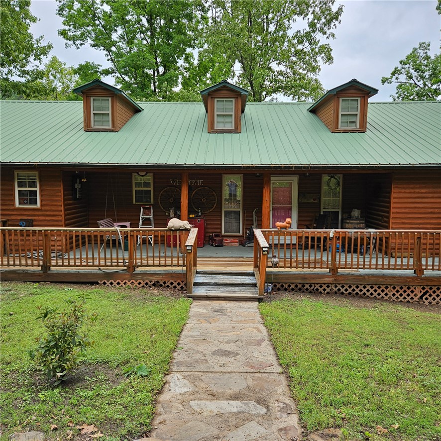 Experience country living at its finest on this beautiful 18 acre property!  This charming 3 BR, 2 BA home offers the perfect blend of comfort, privacy and outdoor enjoyment.  The property features a stocked pond, a storage building, and plenty of room to roam.  A separate guest quarters provides an ideal space for extended family, visitors, or the potential to generate income as an Airbnb or short-term rental.  Whether you're looking for a peaceful homestead, hobby farm, or weekend retreat, this property offers endless possibilities in a picturesque country setting.
Square footage is both primary home plus the log cabin added together.
SF of home is: 1588 and the cabin is 576 SF.