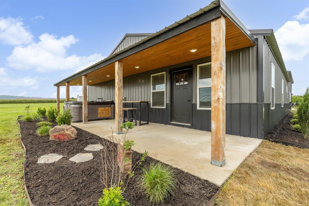 Discover a one-of-a-kind property on 5.73 picturesque acres featuring two exceptional shop houses with a combined 5,800 sq. ft. of heated and cooled living space. The main residence offers 2,800 sq. ft. with 4 bedrooms, 2 baths, and a dedicated office/bar area. The second 3,000 sq. ft. shop includes 1,250 sq. ft. of living quarters with 2 bedrooms and 1 bath, plus a loft, full bar, half bath, fully epoxied floors, and an 18' x 14' insulated garage door. Both buildings feature energy-efficient open-cell spray foam insulation and durable 2x6 exterior walls. Enjoy multiple covered porches, a 12' x 20' covered storage area, and a built-in basketball court. With ample room to build additional homes, this versatile property offers endless possibilities for multi-generational living, business use, or investment. See also MLS# 1353217