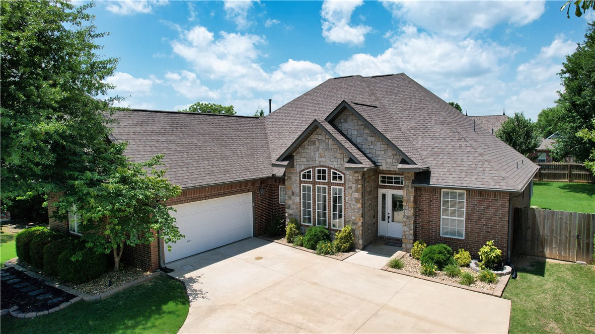 Tucked away in the quiet, established Berry Farm neighborhood yet conveniently close to I-49, the vibrant UPTOWN District, shopping, award-winning schools, the Razorback Greenway, & Mt. Hebron & KJ Memorial Parks. This meticulously maintained home boasts fantastic curb appeal with exterior uplighting & mature landscaping. Major systems have been updated with newer roof & HVAC (2020), plus new engineered hardwood floors (2022), double ovens (2025), & a SMART garage door opener. The kitchen shines with a gas cooktop, new backsplash & granite counters, while a new faucet & light fixture add a fresh, modern touch. The living room has a cathedral ceiling with access to the covered patio. The split floor plan includes a spacious primary suite, two bedrooms share Jack-and-Jill bathroom with an additional bedroom & full bathroom. Step outside to the recently transformed entertainment space featuring a beautifully covered patio wired for sound, new ceiling fan and sunshades with plenty of privacy. Ask for Feature Sheet.