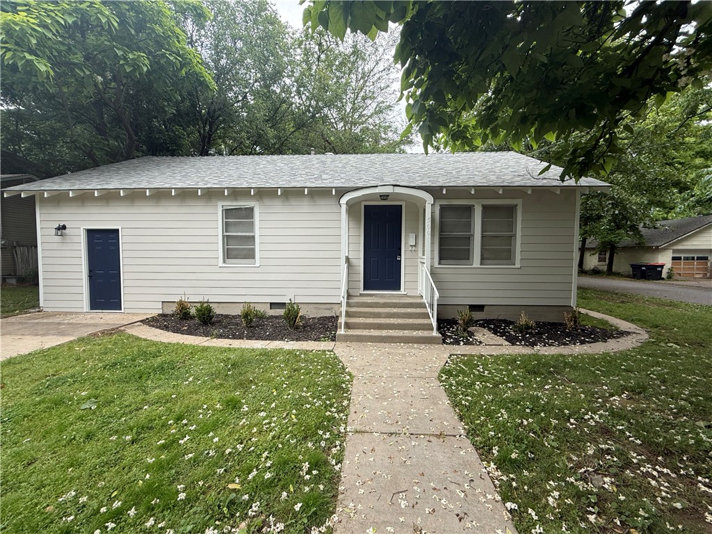 Charming 2 bed, 1 bath corner lot home offering 1,092 sq ft plus a versatile flex/living space from the converted garage. Features include new exterior siding, fresh interior paint, and updated flooring throughout. Located in an incredible spot just minutes from and walkable to downtown Springdale dining, shopping, and entertainment.