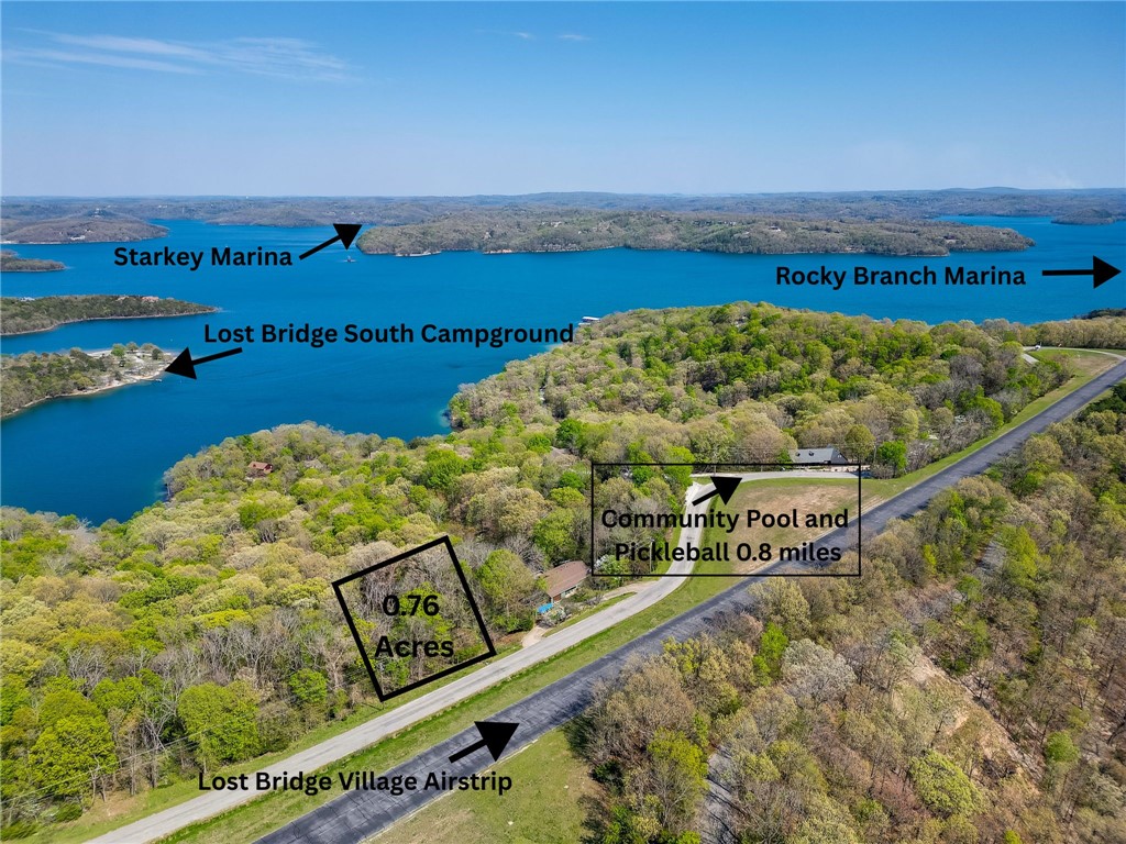 Incredible potential for panoramic lake views of Beaver Lake on this 0.78 acres located across the street from the Lost Bridge Village airstrip. The utilities at the street include public water and sewer. Lost Bridge amenities include a community pool, recreation center, pickleball courts, community events and library. Sellers are related to listing agent.