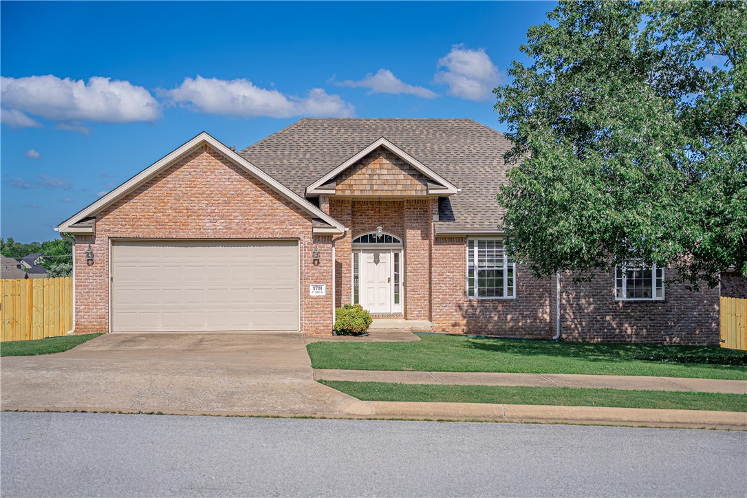 Welcome to Eagle Creek, a tucked-away subdivision in west Bentonville – convenient to XNA, Walmart Distribution Center, schools, restaurants and shopping. This spacious, 2130 sq. ft., all brick home has a NEW roof, NEW deck, NEW 6-ft privacy fence and NEW AC unit. The large living room is bathed in natural light with wood mantle and gas-log fireplace. A movable granite-covered island offers flexibility in the kitchen with extra cabinets, pantry and breakfast area. Wood floors and tray ceiling anchor the dining room. The primary suite has a Safe Step, walk-in bathtub (2022), separate shower, dual vanities and large walk-in closet. French doors open to a separate office with wood floors, built-in desk and bookshelves. There are 2 additional bedrooms and guest bath. Dedicated laundry room has added storage and utility sink. Relax on the extended-covered deck accessed from both the living room and primary suite. Large backyard on a corner lot. Offering $5000 buyer flex funds.