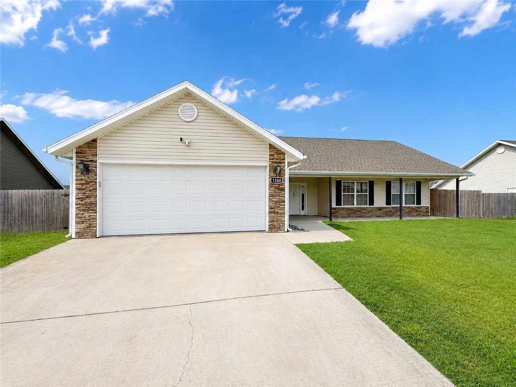 Tucked into Prairie Grove's established Sundowner community, this 3-bedroom, 2-bath split floor plan home has been updated and is ready to go. At 1,561 SF, the layout gives everyone their own space — the primary suite features a jacuzzi tub and walk-in closet, while the open kitchen delivers granite counters, a pantry, and room to actually gather around the table. LVP flooring runs throughout the entire home — no carpet anywhere — so it's as easy to maintain as it is to move into. Out front, a covered porch sets the tone. Out back, a fully fenced yard gives you the flexibility to garden and play. Add in an attached 2-car garage, concrete drive, and ceiling fans throughout. Prairie Grove schools, the Battlefield State Park, and easy access to Fayetteville and the University of Arkansas are all close by — small-town feel without being out of the way.