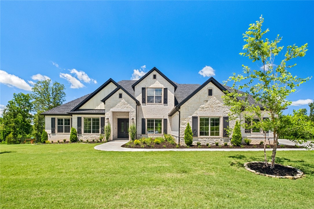 Discover a rare blend of refined living and natural beauty in this serene Healing Springs retreat. Set on over an acre, the property features a heated saltwater pool, hot tub, and backs up to a natural setting.
Inside, the vaulted living room is filled with natural light from floor-to-ceiling windows, framing peaceful views. The main level offers a private primary suite with direct laundry access, two guest suites, a dedicated office, formal dining, eat-in kitchen, and half bath. An oversized 3-car garage provides room for a workshop or extra storage. Upstairs, you’ll find a flexible bonus room, full bath, fourth bedroom, and walk-in attic. Step outside to a fenced backyard designed for both relaxation and entertaining, with a spacious deck surrounded by lush scenery.Tucked within a quiet, established neighborhood yet just minutes from NWA amenities, this home offers the perfect balance of comfort, privacy, and convenience. Make this home yours today!