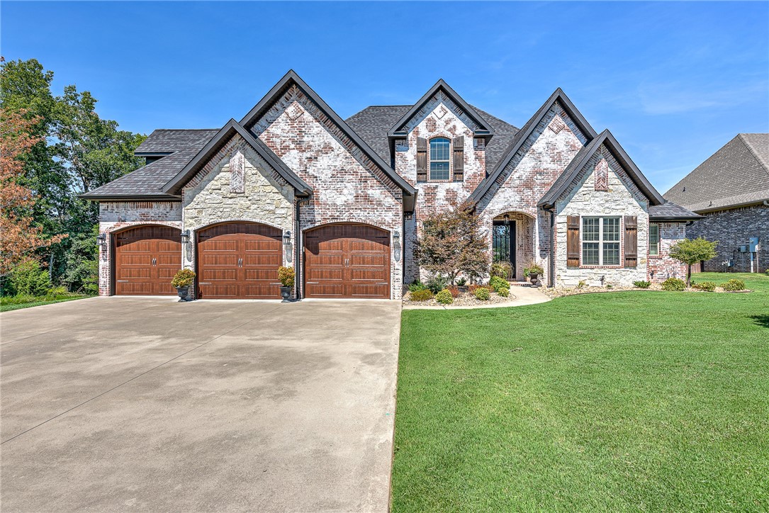 Welcome to Woods Creek! This luxurious home sits on a private wooded lot, checking in at just over an acre! Spacious open floor plan inside is full of high end finishes and amenities. The master suite has a gorgeous bath with clawfoot tub. 3 of the 5 bedrooms are on the ground floor. The private and spacious backyard boasts a heated/cooled saltwater pool surrounded by gorgeous landscaping and built in fire pit sitting area! The whole house has surge protector and lightening protector. This home is a must see!