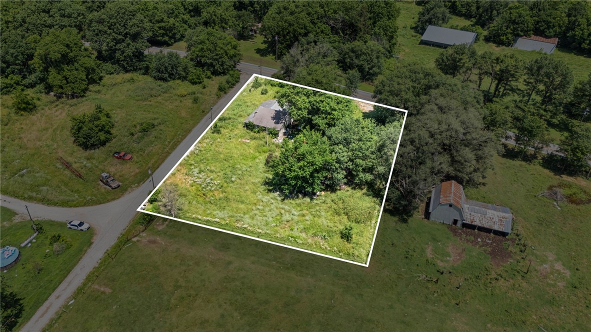 This is a rare opportunity to own an acre mol with an old fixer upper home with no true value being provided, the utilities on the property exist, but there is no real knowledge of what is or isn't available the buyer to satisfy himself with any concerns. Possible development options or rebuild, maybe fix the home. Buyer option!