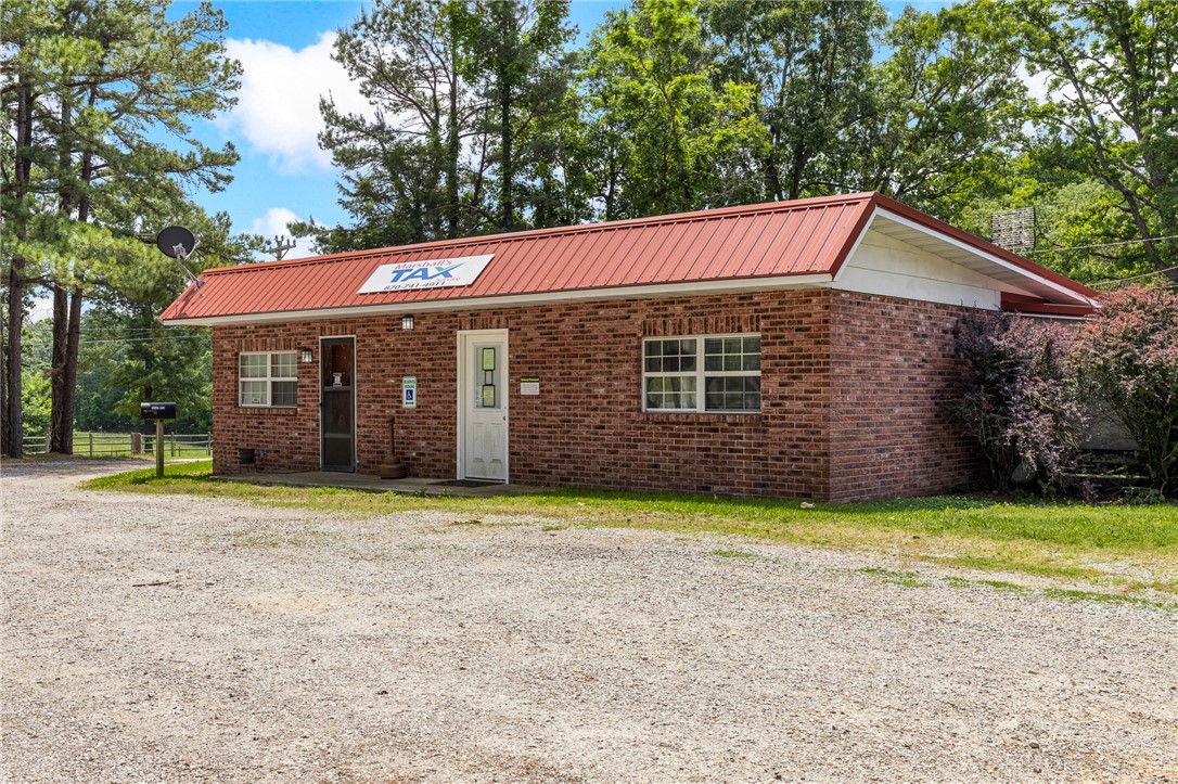 What a unique opportunity to own your own business with both office space and a place to live. With over 40 years in business, Marshall's Tax Service is now for sale. This place has 1200 sq feet of office space, a 2 bedroom, 1 bathroom apartment attached all on over one acre. Maybe you want to rent both sides out, maybe you occupy one side and rent the other side out. Lot of options with this property. This one is priced to sell, come check it out. (Also listed Residential in MLS#1348067)