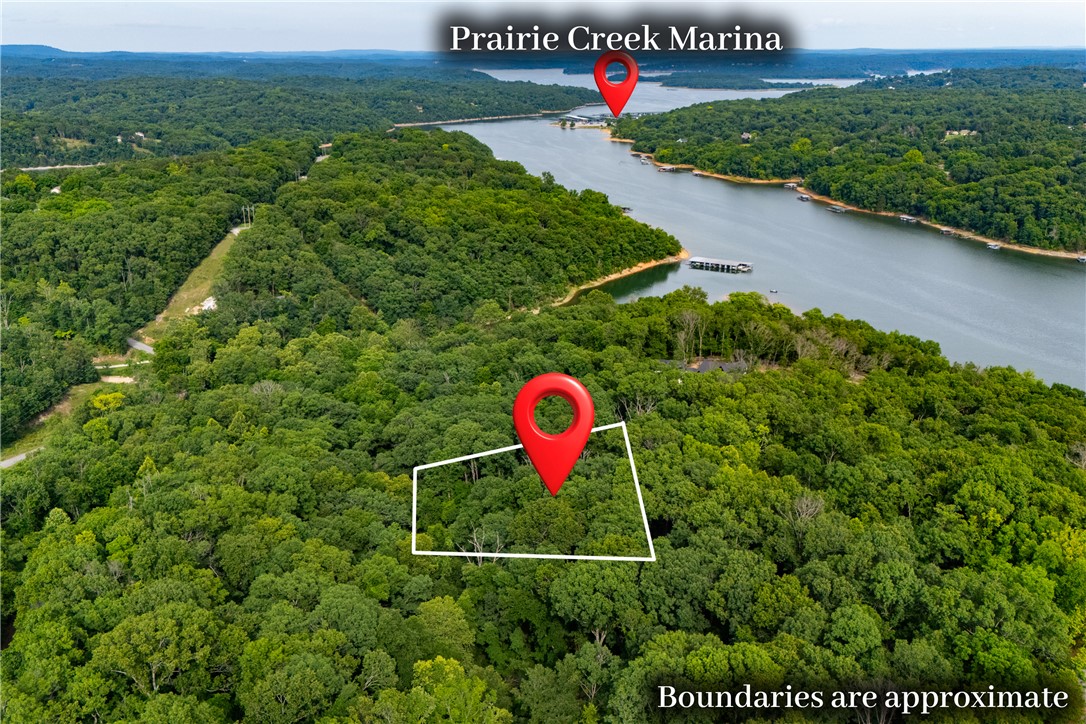 Privacy, acreage, and location rarely come together like this. Tucked near the end of a cul-de-sac in the gated community of Sunset Bay, this 1.77-acre homesite offers a peaceful setting surrounded by mature trees, seasonal Beaver Lake views, and newer luxury homes.

Just 3.8 miles from Downtown Rogers and 3.6 miles from Prairie Creek Marina, you'll enjoy the feeling of being away from it all while remaining minutes from dining, shopping, lake recreation, and everyday conveniences.

The slightly sloping terrain is ideal for a walk-out basement design, creating the opportunity to maximize views and outdoor living. A perc test completed in 2025 was approved for a 3- or 4-bedroom home, giving you a head start on building your vision. Also, current house plans have been designed and can be shared to future home owner. 

Large, private, and exceptionally well located - this is the kind of property buyers wait for and builders search to find.