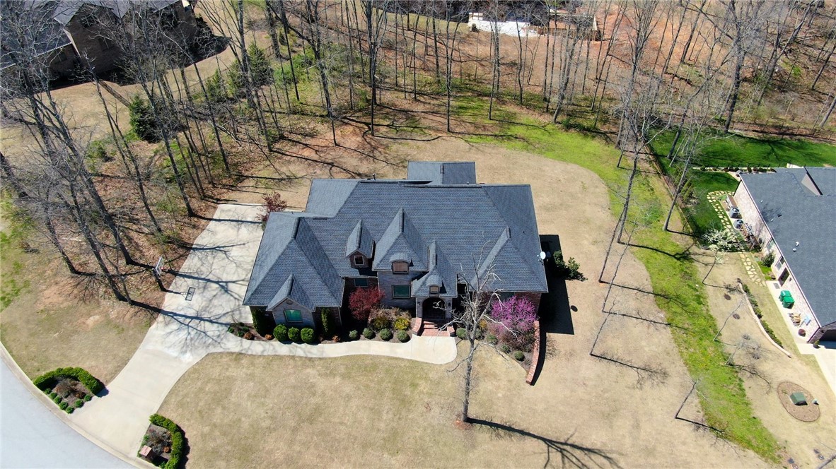 Stunning Custom Built Home by Parade of Homes Builder (Homes of Distinction). Home is located in Popular Versailles Subdivision. Sitting on over an acre Lot w/mature trees & ready for your Pool.  Open Floor Plan w/Formal Dining, Spacious Living Room w/Fireplace, Master on Main & Smart Home Features.  Bright Kitchen is Chef's dream w/Large Island, Double Oven, Granite Counter Tops & Large Pantry.  Gorgeous Master Suite overlooking the backyard w/Hardwood Floors & Double Trey Ceiling. Fabulous Master Bathroom w/Marble Counter Tops, Separate Vanities & Makeup Station, Oversized Walk-in Shower w/Designer Tiles. Guest Suite (In-Law Suite) on main level w/Full Bath.  Amazing Man's Cave in Lower Level w/Media Room & Golf Simulator & Mini-Kitchen / Wet Bar Area.  Super Walk-Out Basement w/10' Ceiling, Concrete Flooring, Living Area, Game Rm, Office, 2 Half-Baths & 2 On-Suite Bedrooms w/Full Baths.   Don’t miss out your chance to own a Beautiful Custom Built Home w/Lots of Great Features.