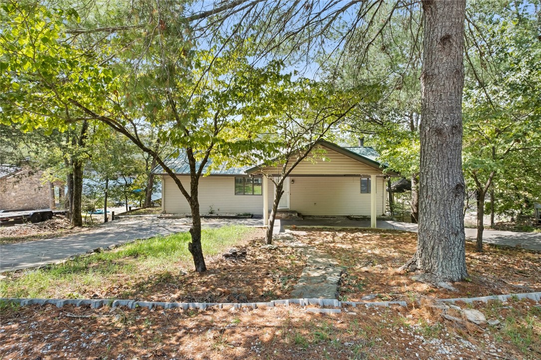 Hard to Find  2 Stall Private Boat Dock A SPECIAL DOCK SET UP  no letting in & out  Dock Floats up & Down  , Boat Lifts Covey , Very  deep cove ( Sail Boat area ) Turtle Cove . Property Sets at the End of a very Private Cove  with a Extra Lot to build  an out door Kitchen OR garage for your play toys. RV Pad with Sewer & Water .
This Is a TURN Key Property Ready For Move in . Paddleboards /Kayaks Several Convey ,  all furnishings convey .