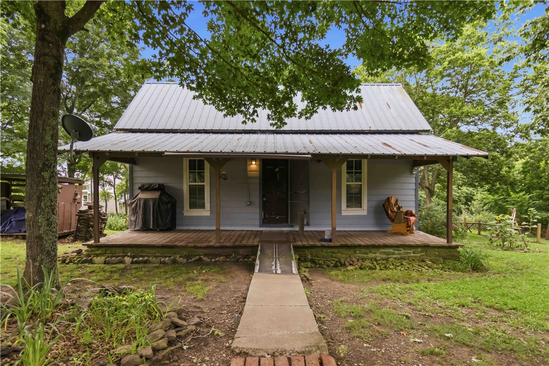 Escape to the Ozarks on 7.16 wooded acres in Winslow. This charming retreat offers privacy, natural beauty, and an unbeatable location just minutes from Devil's Den State Park and the Ozark National Forest—a haven for hikers, outdoor enthusiasts, and anyone craving a slower pace.The home features 1 bedroom and 1 full bath, plus a versatile bonus room currently used as a second sleeping space (no closet)—ideal for guests, a home office, or a creative studio. Thoughtful updates throughout: new windows, new siding, a new water heater, an updated bathroom, and a newly added laundry room.Relax on the covered front porch and take in the peaceful surroundings, or explore thousands of acres of protected wilderness right at your doorstep. Whether you're seeking a full-time residence, a weekend getaway, or an income-producing short-term rental, this Ozark gem delivers.Acreage, updates, and location—don't miss this rare opportunity in one of Arkansas's most scenic settings.