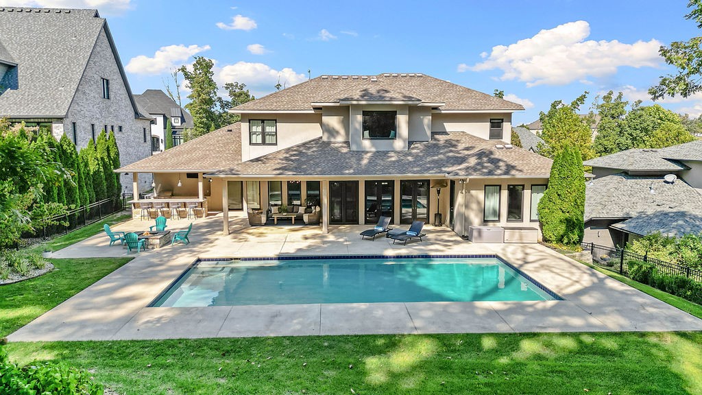 Experience refined living in this 5,058 sq. ft. masterpiece in the Shadow Valley community. This 5-bedroom, 5.5-bath residence offers timeless elegance with designer finishes & thoughtful details throughout. Beautiful hardwood flooring, endless windows allowing natural light to pour in, & both primary and secondary bedrooms on main level.  The chef’s kitchen boasts Thermador appliances, double ovens, large island, ice maker, wine fridge, & walk in pantry. This home has built-ins throughout, a beautiful office space & a formal dining room perfect for gatherings. The upstairs bonus room & additional game room provide versatile space for entertaining. Step outside to your private retreat featuring a heated in-ground pool, outdoor kitchen, and fire pit—ideal for year-round enjoyment with a view of the golf course. Modern comforts include an EV charger & abundant storage. With its seamless blend of sophistication, functionality, & resort-style amenities, this box-checker truly has it all.