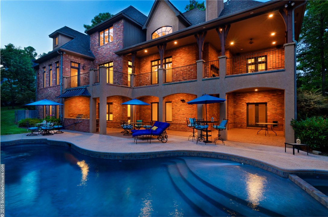 Magnificent French Country 3 level Parade Home overlooks 14th tee box on beautiful Robert Trent Jones Jr golf course. 5 or 6 bedrooms, 6 baths, 2 kitchens, 2 game rooms, theatre room, den, 3 fireplaces, office. Walk-through shower between his/her vanities in the master bath. The 2nd kitchen on the lower level provides for a possible in-law suite or just for entertaining! Lower level opens up to a fabulous pool, covered deck and outdoor cooking area.All new paint and updates for like new condition.MUST SEE!