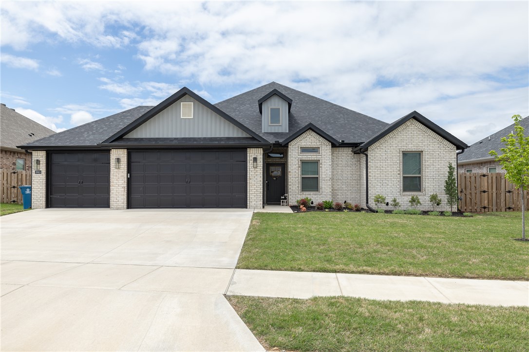 Don't miss this immaculate 4 bedroom, 2 and a half bath home with a 3 car garage in Wellington Hills. Located in the heart of Pea Ridge, this almost new construction property is close to shopping, dining, schools, and local parks. The kitchen is a chef's dream: custom kitchen cabinets, quartz countertops, stainless steel appliances, kitchen island, pantry, and custom wood hood over the gas range. Eat-in dining is large enough to fit all your guests and leads out to the large covered patio and fully fenced-in back yard. Open concept living makes the home warm and welcoming, while the split floor plan creates privacy and space for everyone.