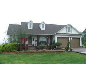 Beautiful custom country home minutes from Harrison is a pleasure to live in! Open floor plan is accentuated by a large country kitchen w/pantry & dining area, living room features a stone gas log fireplace, master bath features tile step-in shower & claw footed bath tub w/hickory cabinets. Warm colors through out and special features enrich the country charm! Covered deck & porch.