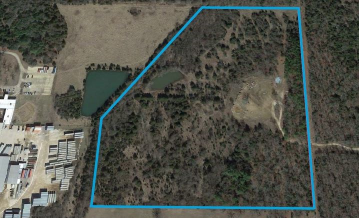 Topography is flat with covered timber and +/- 20,000 SF pond, Zoning I-2, Utilities are available on the street