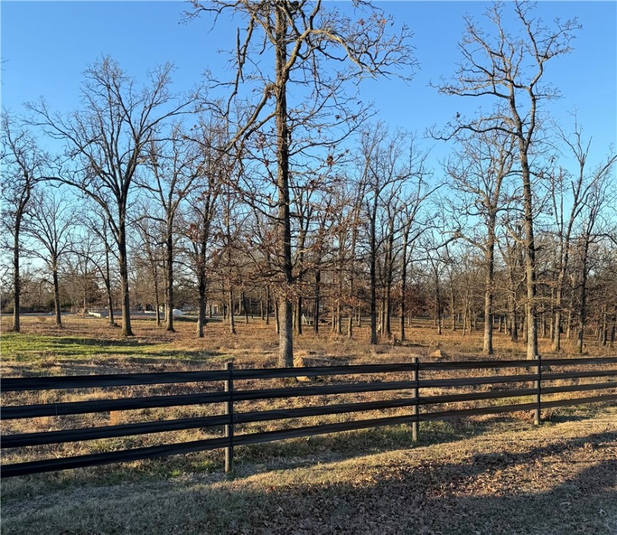 This is a fantastic building site for your new home! 3.4 Acres with paved road frontage and electric at the road. It has a water tap and is partially fenced. Beautiful setting and close to town. No mobiles or manufactured homes allowed. Don't miss out on this one to build your dream home