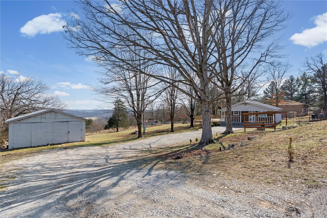 This charming 3 bedroom 1 bath home with a basement level has a newer A/C unit, new water heater, wood cabinetry in kitchen, gazebo and new deck built on January 2025 sits on 2.53 acres. Back porch has beautiful views of War Eagle Valley. The front of property has some highway road frontage. This home also features a detached 1,110 sqft shop great for handyman. Perfect home for investors, weekend getaway or first time home buyers.
Home is located right off HWY 412 Business not far from new development and minutes away from Walmart and Huntsville Schools.
This home is about 1 hour from Branson and about half hour from Fayetteville and Eureka Springs.