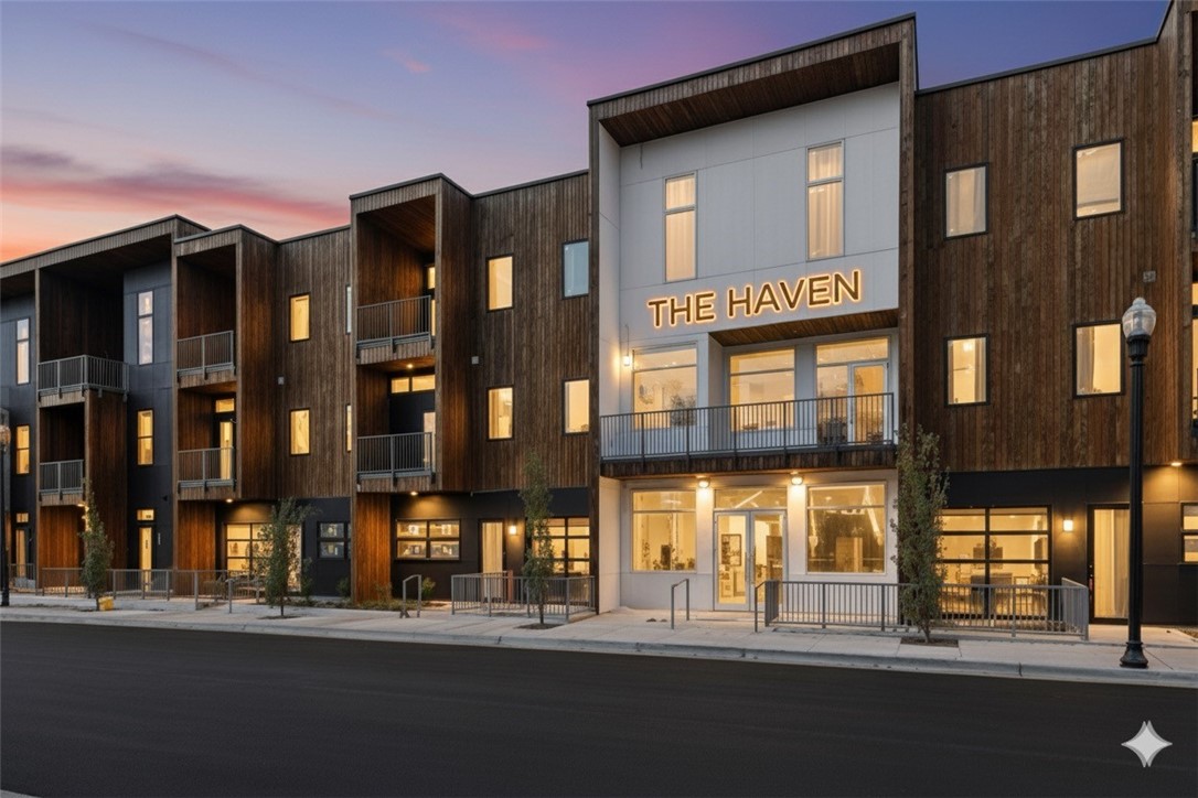 Welcome to THE HAVEN, a collection of 29 luxury residences where architectural sophistication meets ultimate urban convenience. This flat is positioned to offer a dynamic lifestyle with unparalleled walkability.  Step inside your open-concept sanctuary bathed in natural light. The kitchen is anchored by a waterfall-edge island, top-tier appliances and custom white oak cabinetry.  The primary suite features a translucent glass privacy panel allowing you to customize the space between an airy studio feel and total privacy. The walk-in closet leads to the bathroom with a tiled accent wall and a triple-head shower with a comfortable bench. The versatile second room off the kitchen also features a privacy panel and a built-in workstation/wardrobe, making it an ideal flex-space or sophisticated home office.  With private garage access directly into the community and a coveted location between the new WM campus and Bentonville Square., you are moments away from the city's best coffee, dining, and cultural attractions.