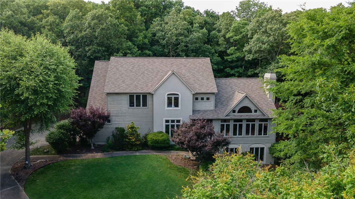Distinctive private retreat crafted by a leading NWA custom builder on a quiet cut-de-sac in East Fayetteville & only 5 minutes from the commercial district. Picture windows offer natural light & spectacular views of greenery of the 3.27 acre secluded  lot, which is ideal for private nature & gardens. Quick access to free, private POA-owned White River access for camping, fishing & other sports is included in POA dues. Remodeled gourmet kitchen, new HVAC & large, low maintenance TREX deck, plus 3 car garage with ample storage, extensive guest parking a a natural gas powered Generac whole-house generator make this unique 5 bedroom, 3.5 bath home with high ceilings, large closets and a walkout basement perfect for family and guests. The 2nd level primary suite boasts an expansive walk-in closet, stunning remodeled bathroom with a stand alone shower, free standing soaker tub and beautiful view of the woods behind you. Other features include an office, electronic security system, gas fireplace and fully irrigated yard.